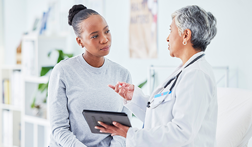 A doctor consulting with a patient in a well-lit medical office.