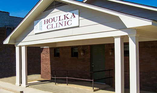 Exterior of the Houlka Clinic building with handicap accessibility and clear signage.